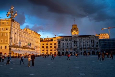 Town Hall and Palazzo Stratti in the evening light at sunset, Piazza Unità d'Italia square,