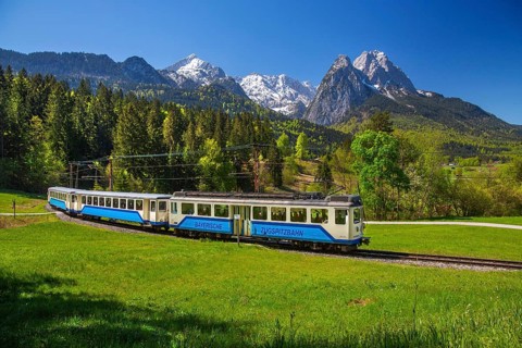 Bavarian Zugspitzbahn rack railway in front of Alpspitze 2628 m and Waxenstein 2277 m in spring,