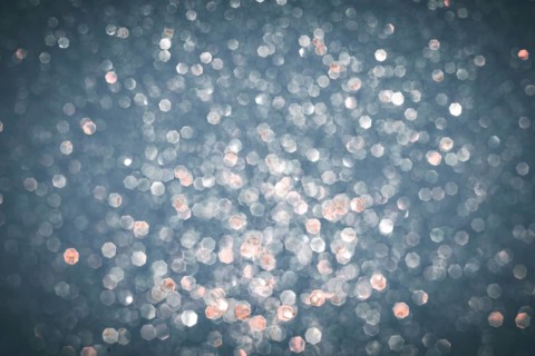Abstract glitter lights textured silver, gray and white colored background, de-focused, bokeh.