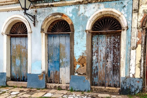 Blue wooden doors on an old house in the historic town of Alcantara, Maranhao, Alcantara, Maranhao,