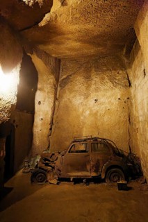 Rotten Lancia Aurelia from the 1950s, car cemetery, Galleria Borbonica, Bourbon Tunnel, underground