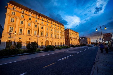 Magnificent buildings on the Riva del Mandracchio seaside promenade in the evening light at sunset,