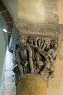 Capital of romanesque church of Saint Nectaire, Tethered Monkey, Puy de Dome, Auvergne Rhone Alpes,