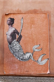 Paste-up Sirena Bicaudata, two-tailed siren, figure from the founding myth of Naples, street art in