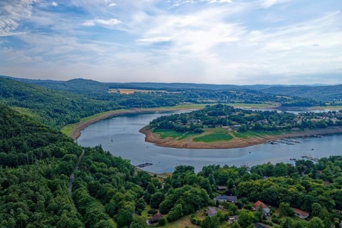 The Eder river loop around the village of Scheid, Rehbach in the foreground, in the