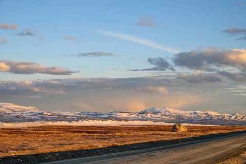 Storsjö Kapell, Jämtlands län, Sweden, mountains and snow-covered plains under clear sky with a