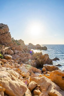 Landscape of the coastline with blue water at Costa Paradiso on a sunny day at evening, Sardinia,