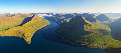 Panoramic view of Funningsfjørður near Funningur on Eysturoy island, fjord with steep mountains,