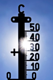 Thermometer shows heat in blazing sun and cloudless sky, symbolic image, summer 2026, Witten, North