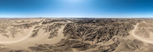 Aerial view, dry barren mountains in Moon Valley, rocky landscape ridged by erosion, Namib-Naukluft