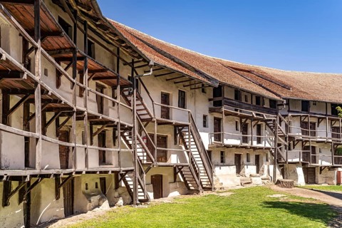 Inner side of the defensive wall with storerooms of the Tartlau fortified church, part of the