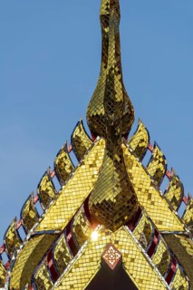 Chofas (distinctive features of Thai temple architecture), pointed roof ornaments, ubosot