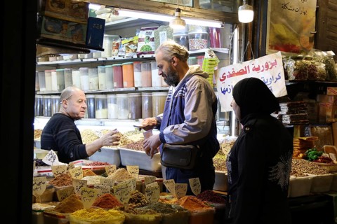 Syrians shop at the historic Al-Hamidiyah Bazaar adjacent to the Umayyad Mosque during the early