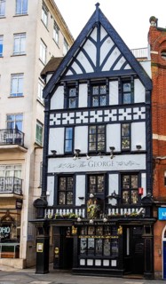 The George, a Victorian half-timbered rebuild of an 18th century coffee house, stands opposite the