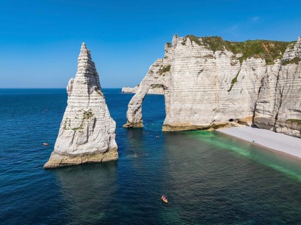 Aerial view of the Porte d'Aval rock formation, a landmark on the chalk coast with the distinctive