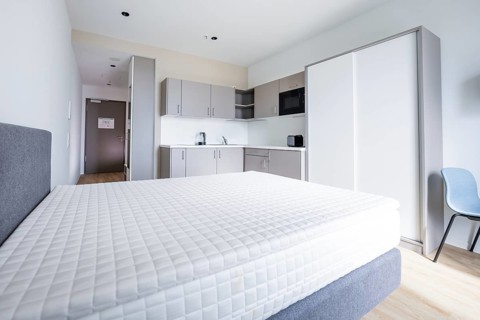 A modern studio apartment with kitchen, bed and bright, minimalistic design, Boarding House of