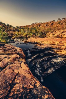 Bell Gorge waterfall, a body of water in north-west Australia in the Kimberley. Sunrise in the