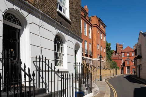 Narrow street lined with historic brick buildings, quiet residential area, Chelsea, London, Great
