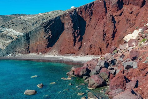 Red Cliffs and Turquoise Water of Santorini's Red Beach, A beach with striking red cliffs bordering