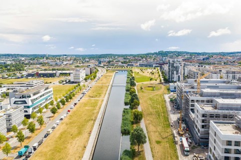 Urban landscape from above with a river, modern buildings and a cloudy sky, new hospital building,
