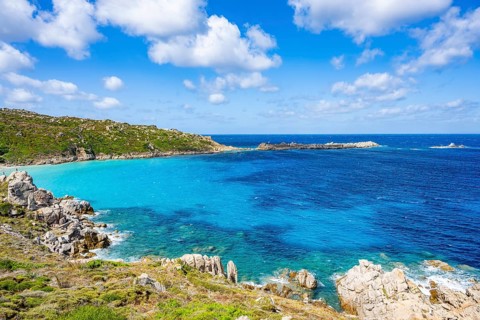 Coastline with emerald green and blue water on a sunny day at Santa Teresa di Gallura, Sardinia,