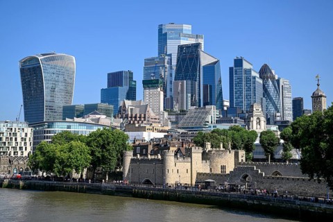 View from Tower Bridge of the City of London skyline with the Tower of London and skyscrapers such