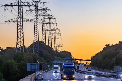 High-voltage pylons, transmission lines at sunset along the A5 motorway near Pforzheim. Pforzheim,