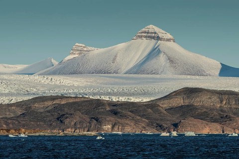 Glacier front and one of the three mountains known as Tee Kroner (Three Crowns), Kronebreen or