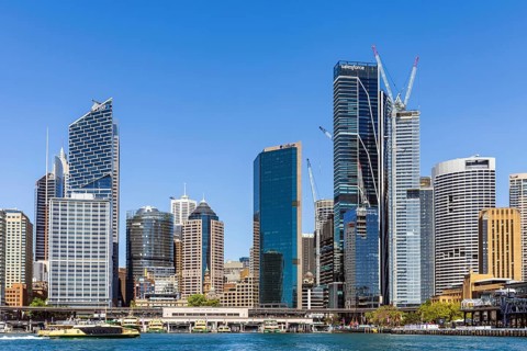 Tall skyscrapers of the CBD rise above the Circular Quay Ferry Terminal, Sydney, Australia