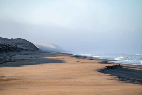 Atlantic coast, sandy beach and sand dunes, desert landscape and sea, Namib Naukluft Park, Namib