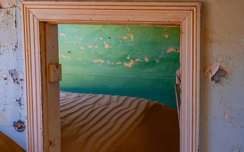 Interior view, doors and house full of sand, former diamond mining town, Namib Desert, Kolmanskop,