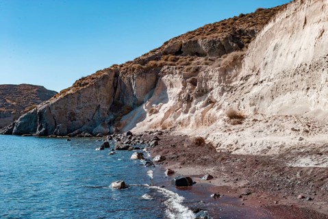 White Rock and sea at white beach of Aspri in Santorini, Rocky coastal landscape with cliffs and