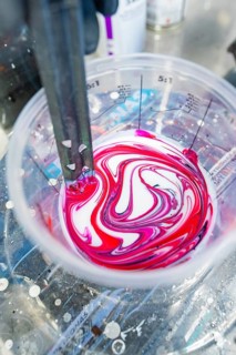 Color pattern with red and white in a measuring cup, preparation for mixing, painter, Calw, Germany