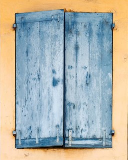Window with closed blue shutters, Provence, France