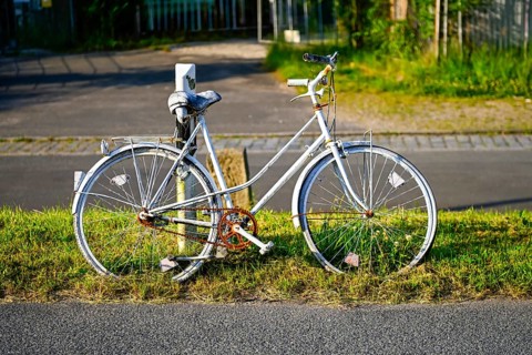 White-painted bicycle on the side of the road as a reminder of a cyclist in Rothenburgsort,