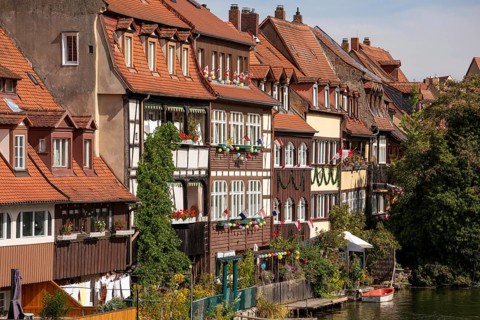 20 August 2026, decorated historic half-timbered houses along the Regnitz river during the