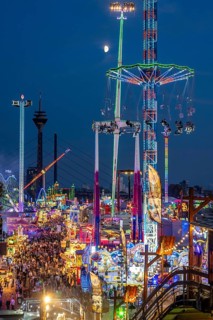 Rhine fair in the Rheinwiesen in Düsseldorf-Oberkassel, view towards the Rhine Tower,