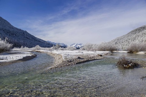 Isar valley in winter at temperatures of minus 18 degrees Celsius. Snow covered landscape with the