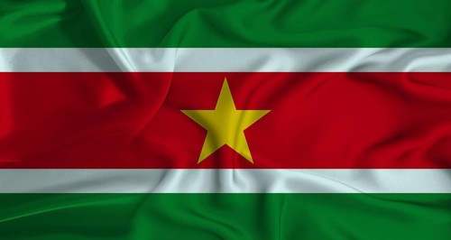 Realistic Suriname flag waving. Close up of flag of Suriname with cloth texture