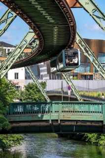 The Wuppertal suspension railway runs above along the Wupper River, between the central railway