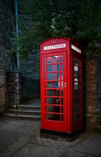Red telephone box, illuminated, Falmouth, Cornwall, England, Great Britain, Great Britain