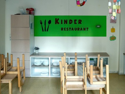 High-standing wooden chairs in the children's restaurant of a daycare center, Berlin, 11.08.2026,
