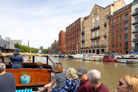 Passengers onboard boat trip on the Floating Harbour, River Avon, Bristol, England, UK