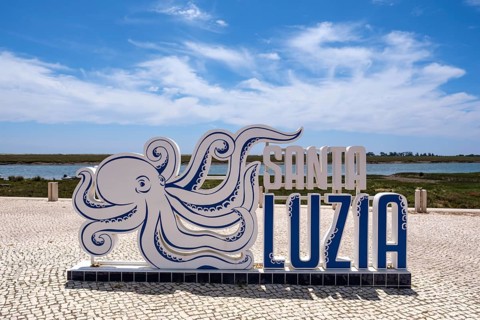 Santa Luzia sign with octopus design under clear sky, Santa Luzia, Tavira, Faro, Portugal
