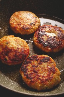 Fried chicken cutlets, with vegetables, in a frying pan, homemade, no people