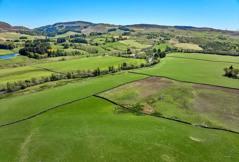 Aerial drone photo of agricultural landscape with meadows and pastures at the border of the Cairn
