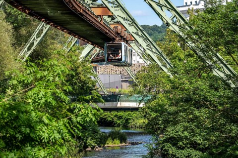 The Wuppertal suspension railway runs above along the Wupper River, between the central railway