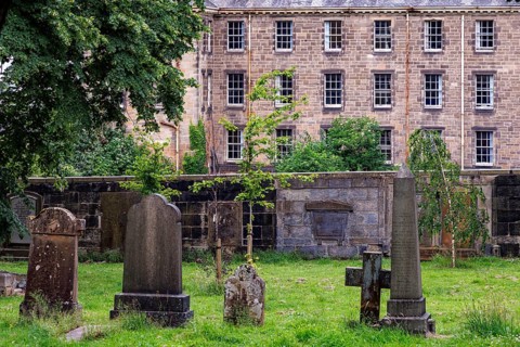 Weathered gravestones Gravestones in historic burial ground near Glasgow Royal Infirmary with the