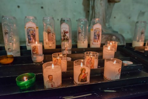 Burning commemorative candles in a church