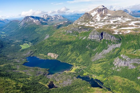 View from the summit of Innerdalstårnet of mountainous landscape, Innerdalen high valley and lake